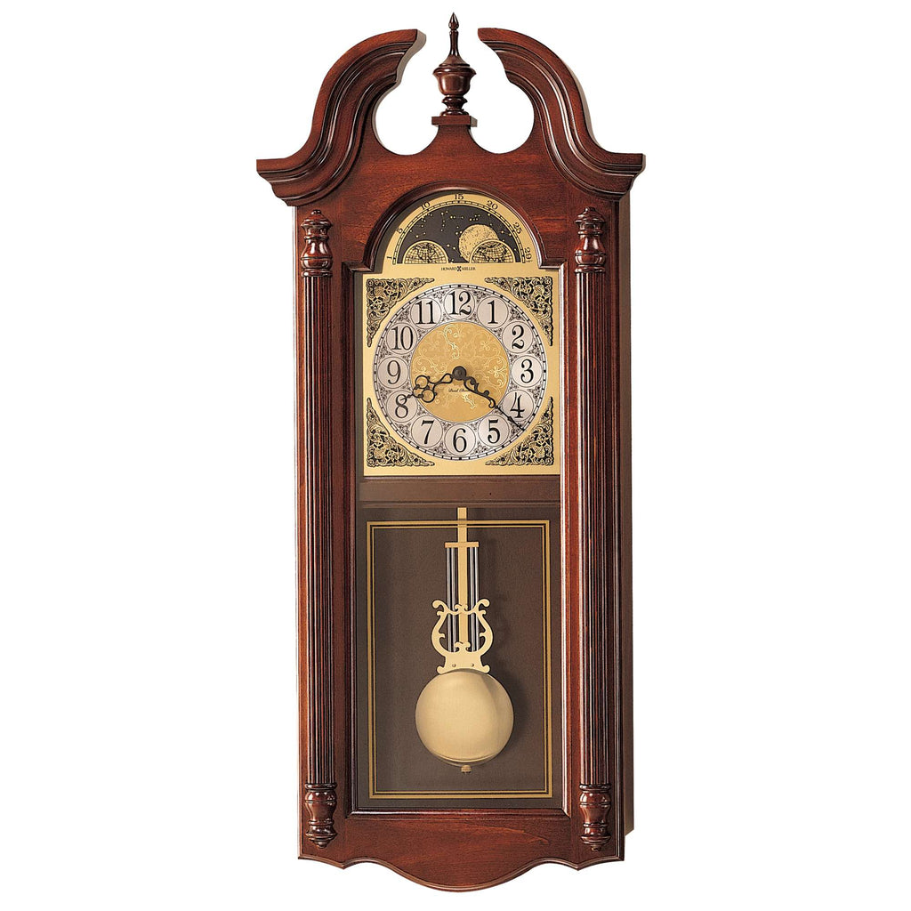 A vintage wall clock with a wooden frame, featuring a pendulum and ornate clock face.