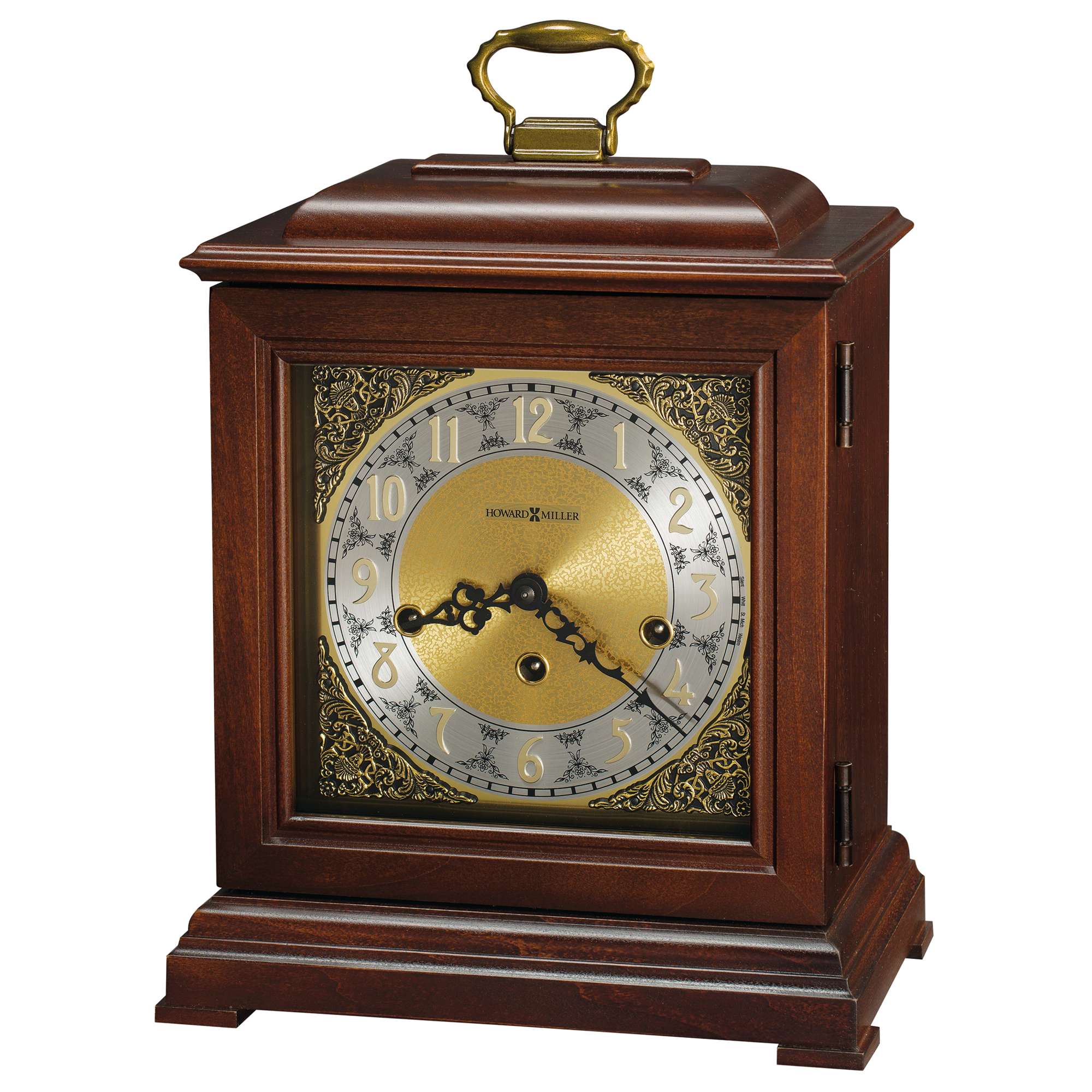 A vintage-style wooden mantel clock with a brass handle and ornate detailing.
