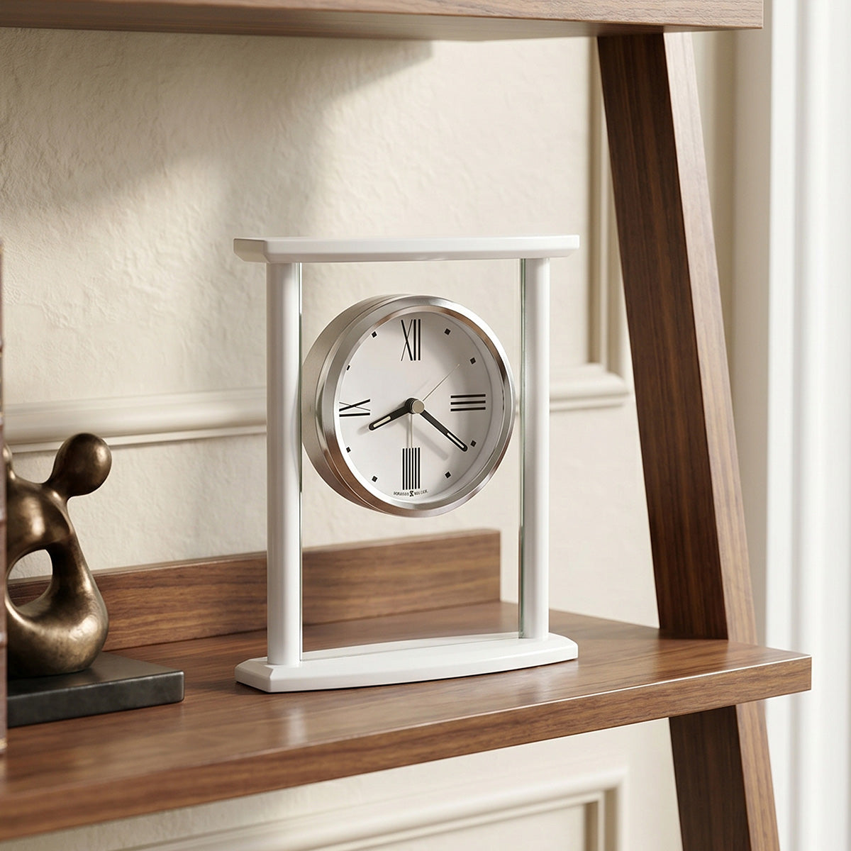Table clock on a wooden shelf with a neutral background