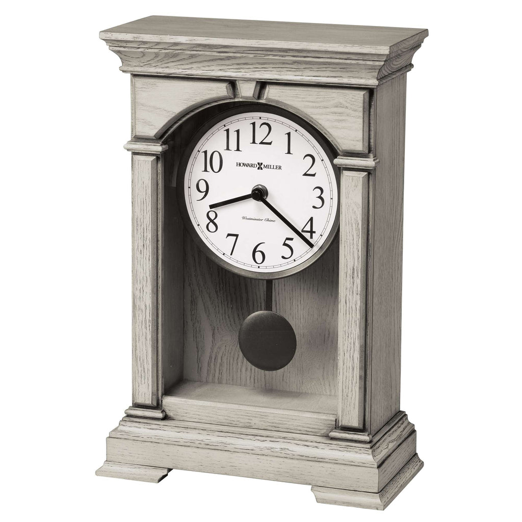 A vintage-style mantel clock with a wooden frame and a round white clock face.