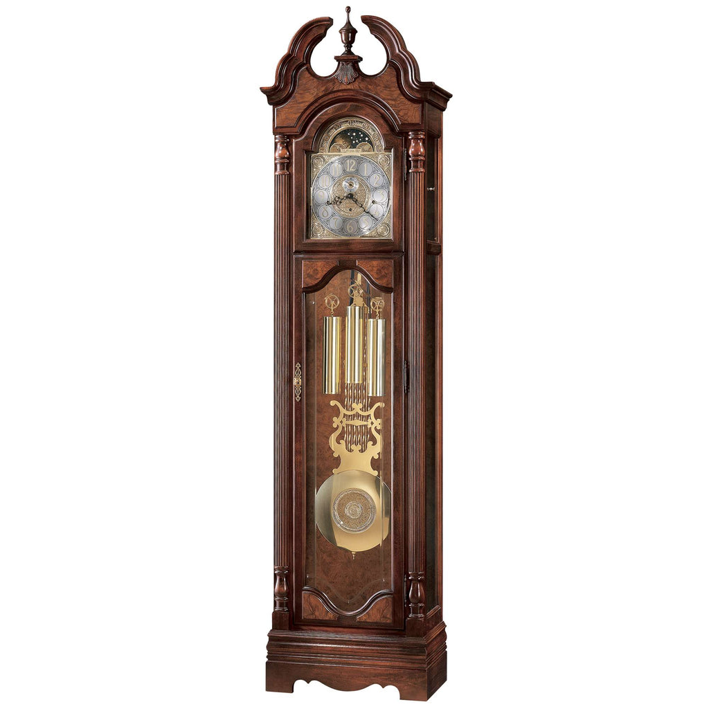 A wooden grandfather clock with ornate design and glass panels.
