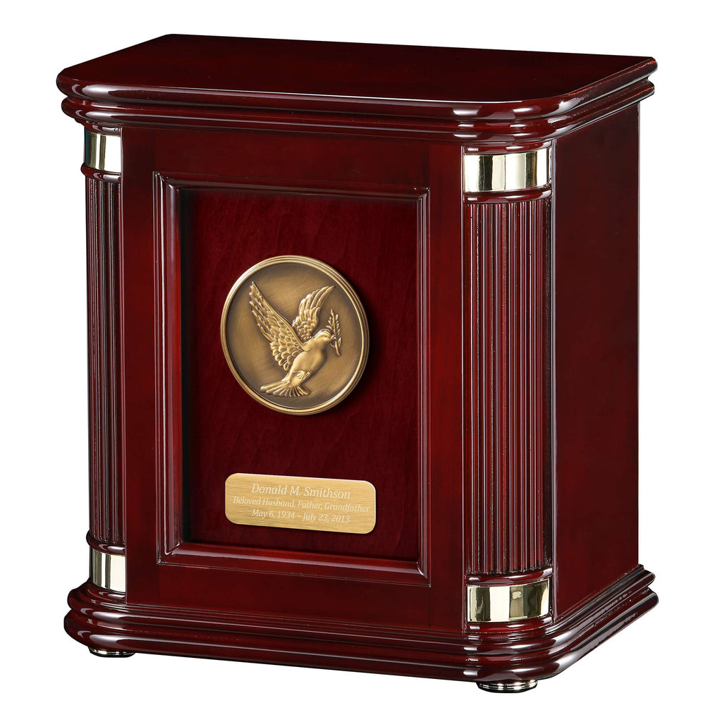 A polished wooden award or trophy case with a circular bronze emblem and a plaque.