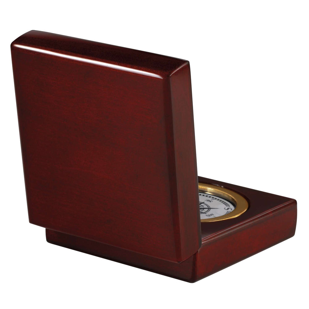 A wooden box with a round clock partially visible inside.