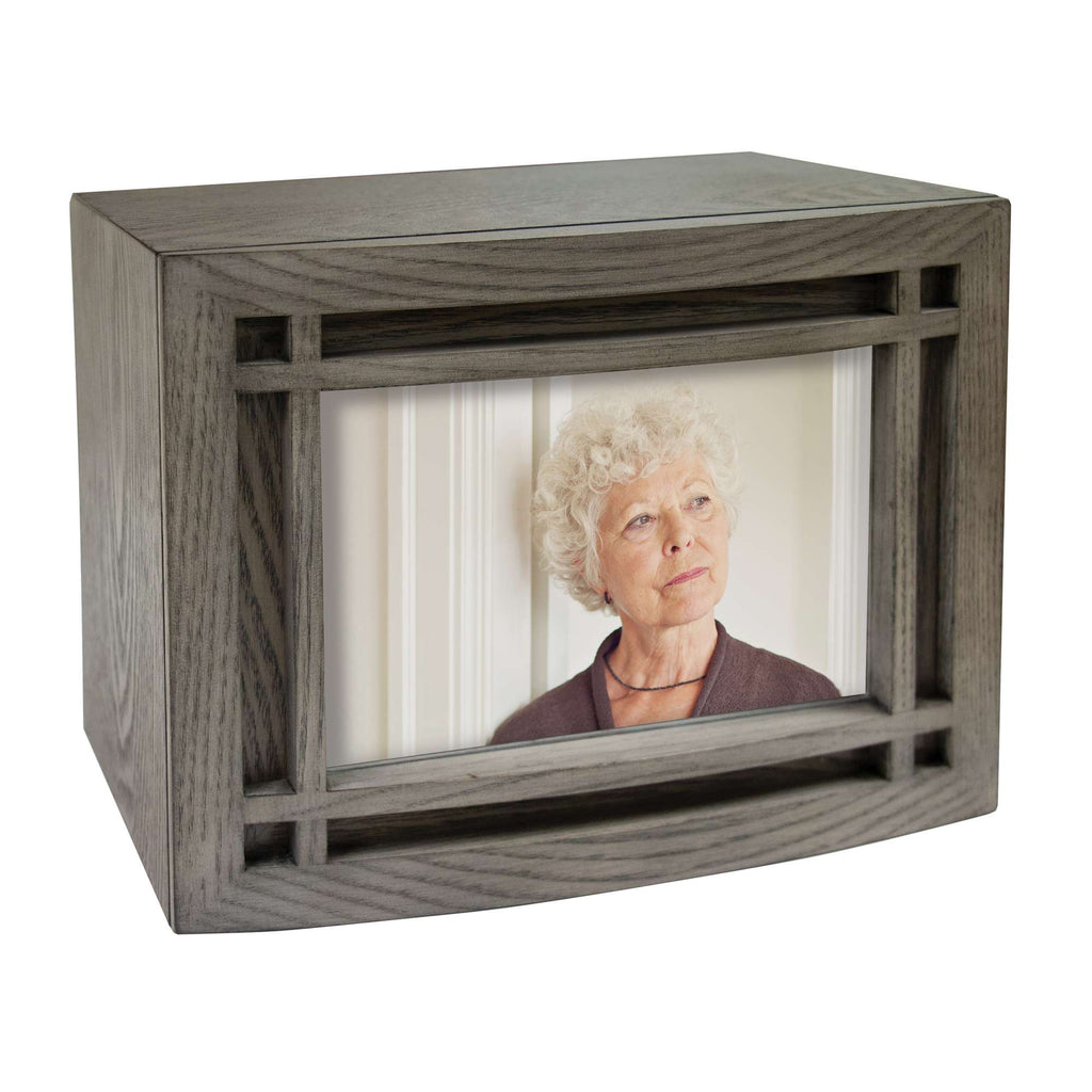 A decorative photo frame featuring a portrait of a woman with curly hair.