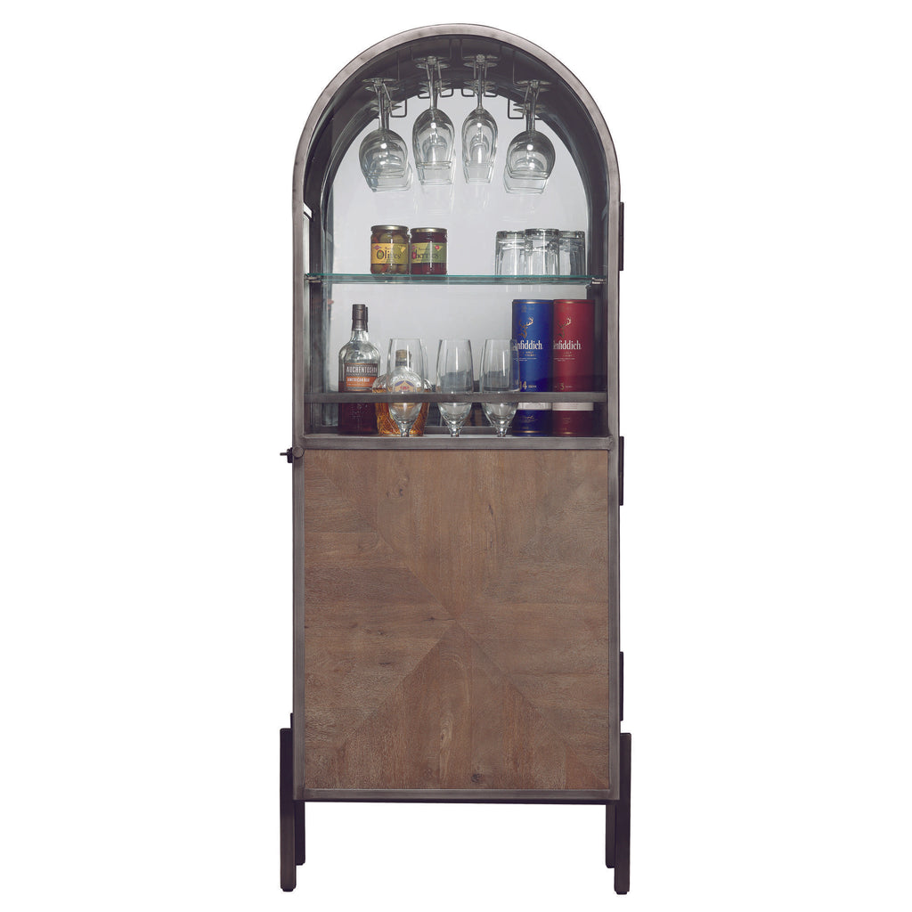 A stylish bar cabinet with glassware and bottles displayed behind a curved glass top.