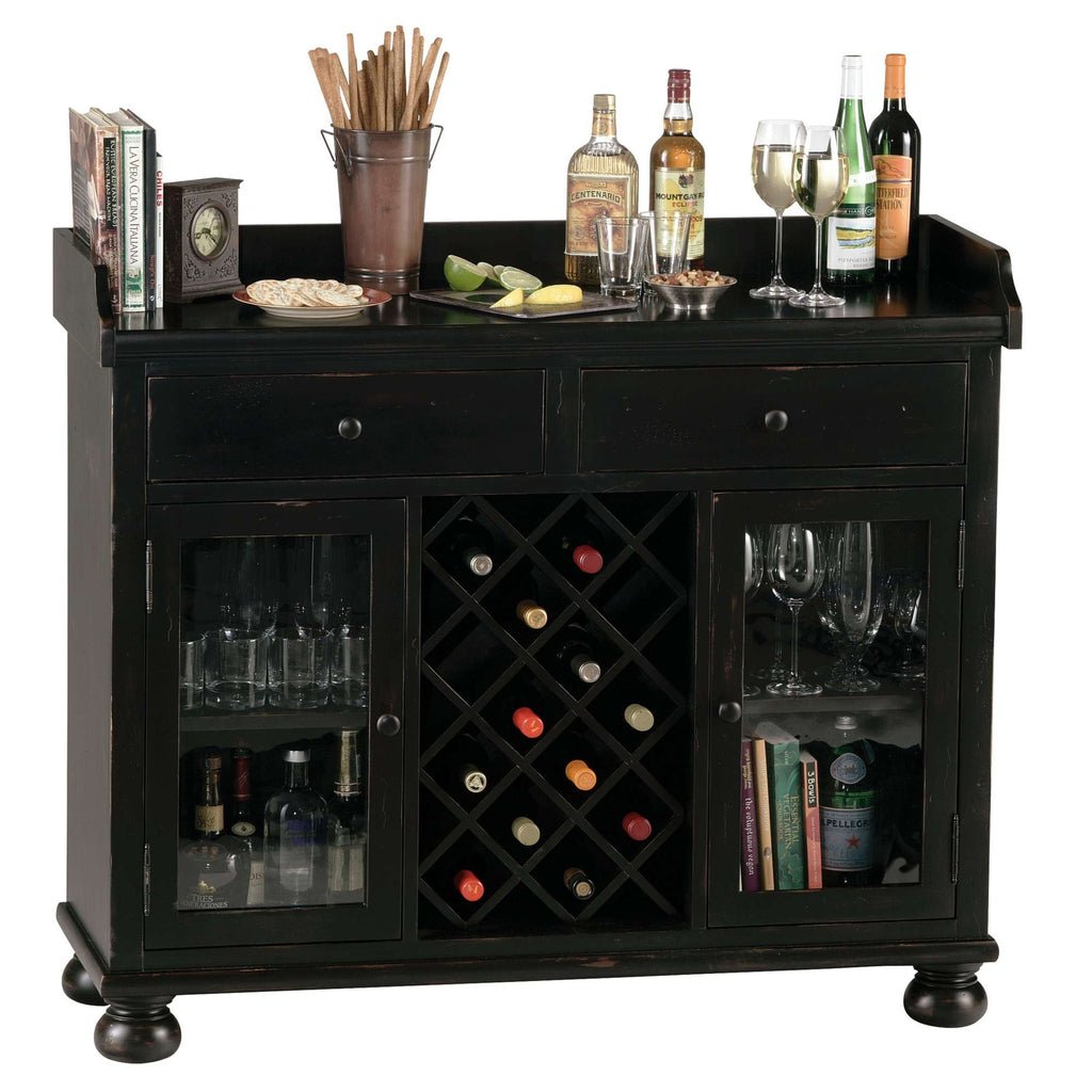 A stylish black bar cabinet with bottles of liquor, glasses, and a wine rack