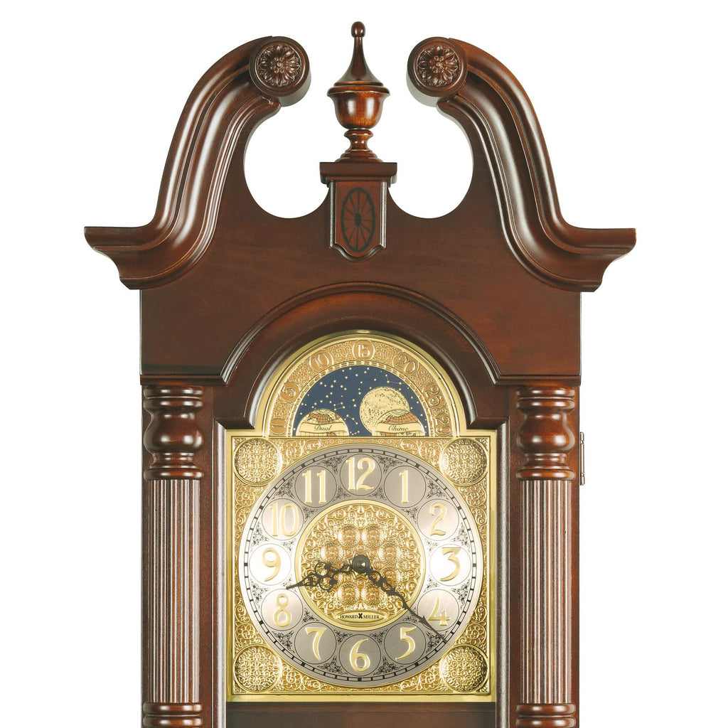 Ornate wooden grandfather clock with a detailed golden clock face and elegant design.