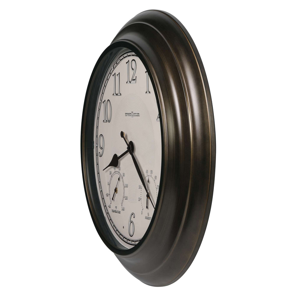 A round wall clock with a bronze frame and large numerals.