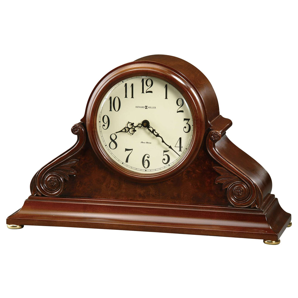 Antique-style mantel clock with a wooden finish and ornate design.