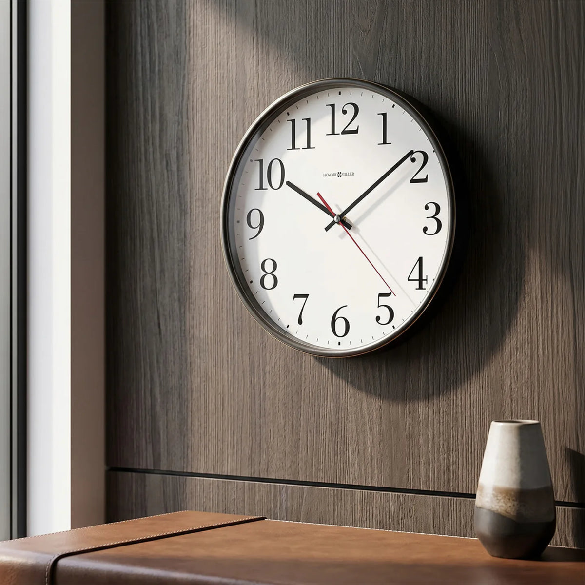Howard Miller Office Mate Wall Clock, 10-inch, on the wall in a styled room
