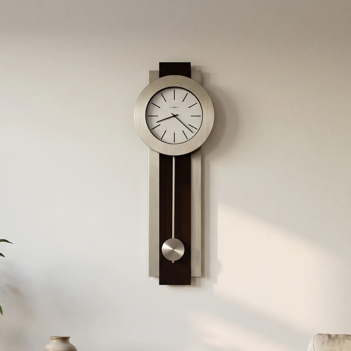 Howard Miller Bergen Wall Clock, 35-inch, on the wall in a styled room