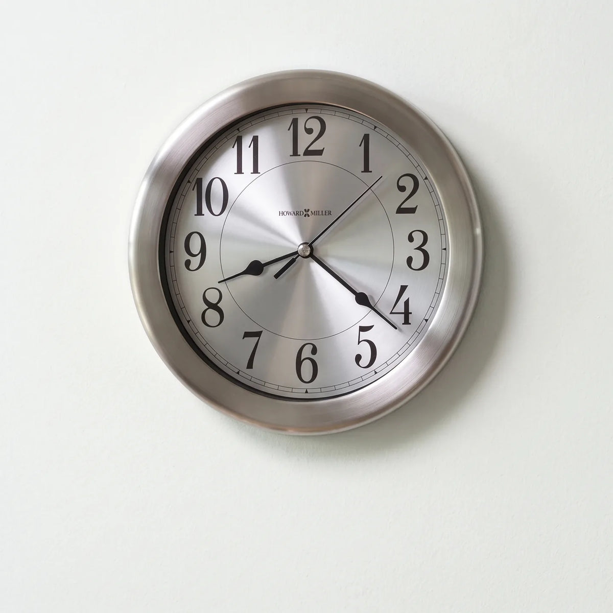 Howard Miller Pisces Wall Clock, 8-inch, front view on a plain white background