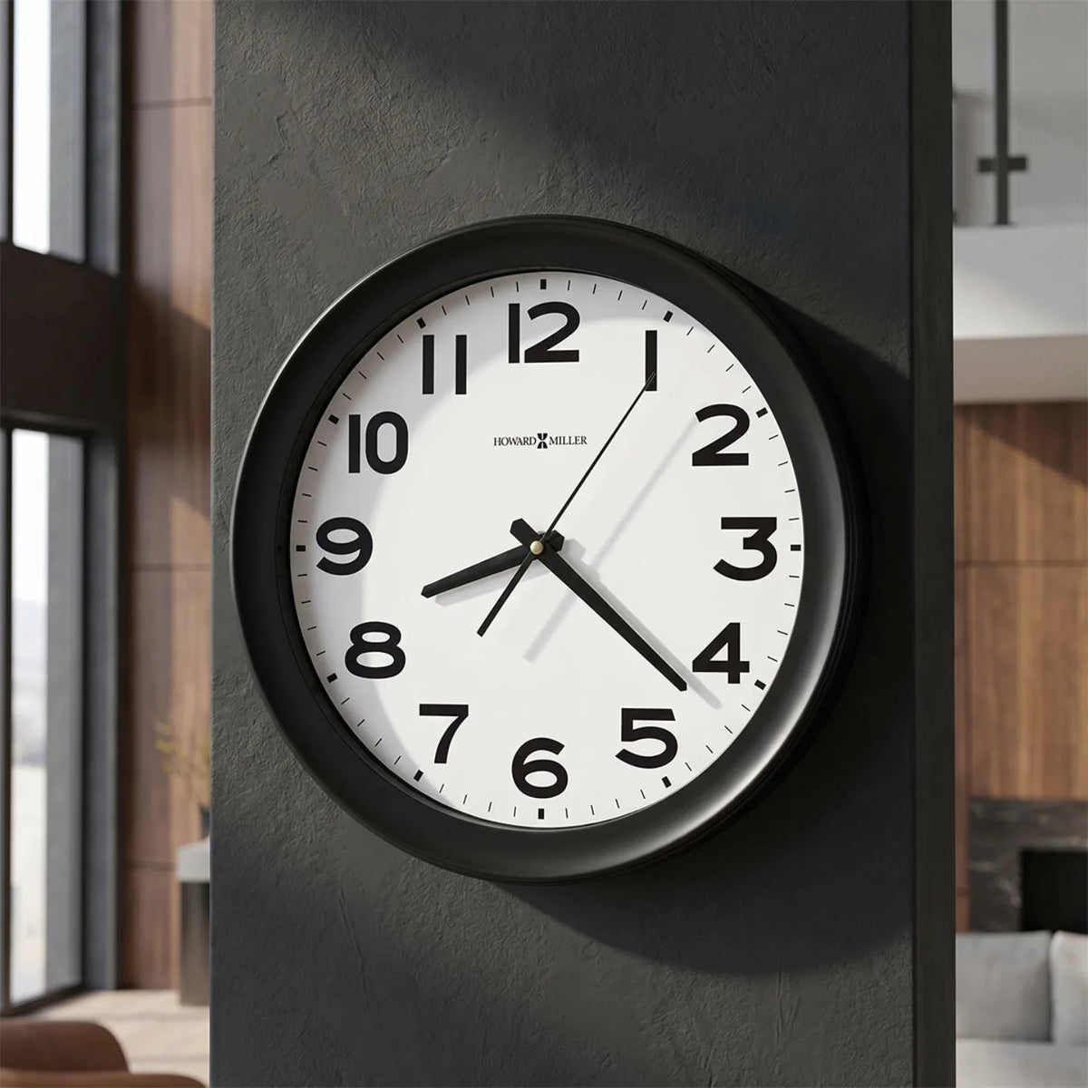 Howard Miller Kenwick Wall Clock, 14-inch, on the wall in a styled room