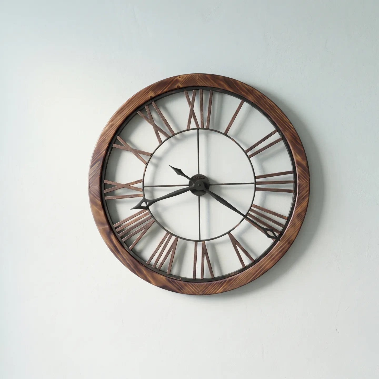 Howard Miller Thatcher Wall Clock, 32-inch, front view on a plain white background