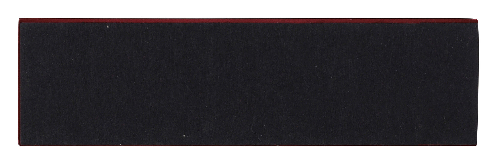 A rectangular black object with a red edge