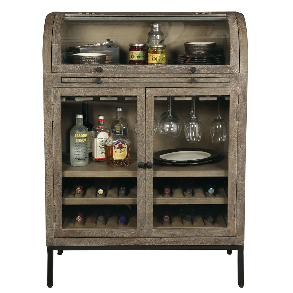 A wooden bar cabinet featuring a top glass section, bottles, glasses, and shelves filled with wine bottles.