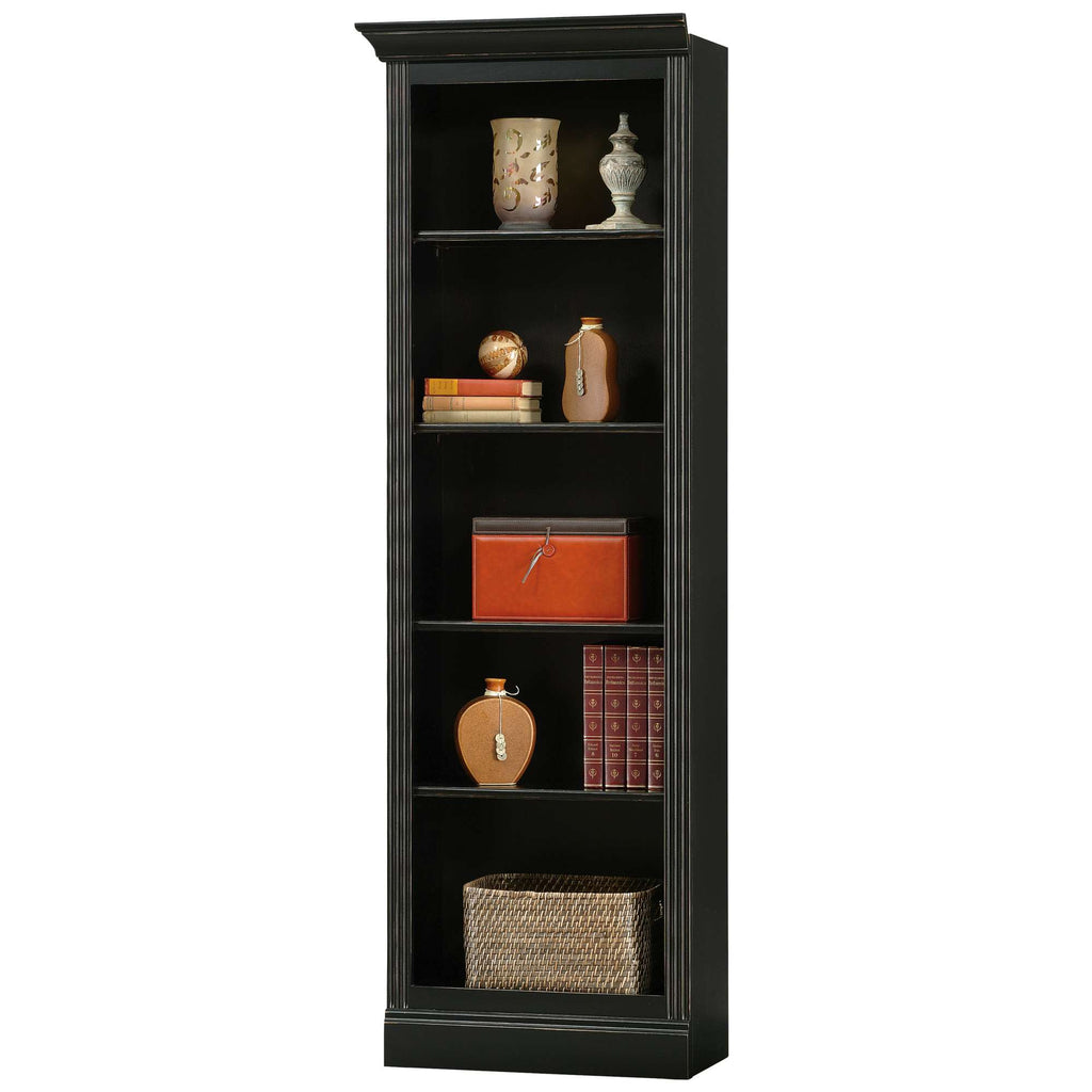 Tall black bookshelf with various decorative items and books arranged on several shelves.