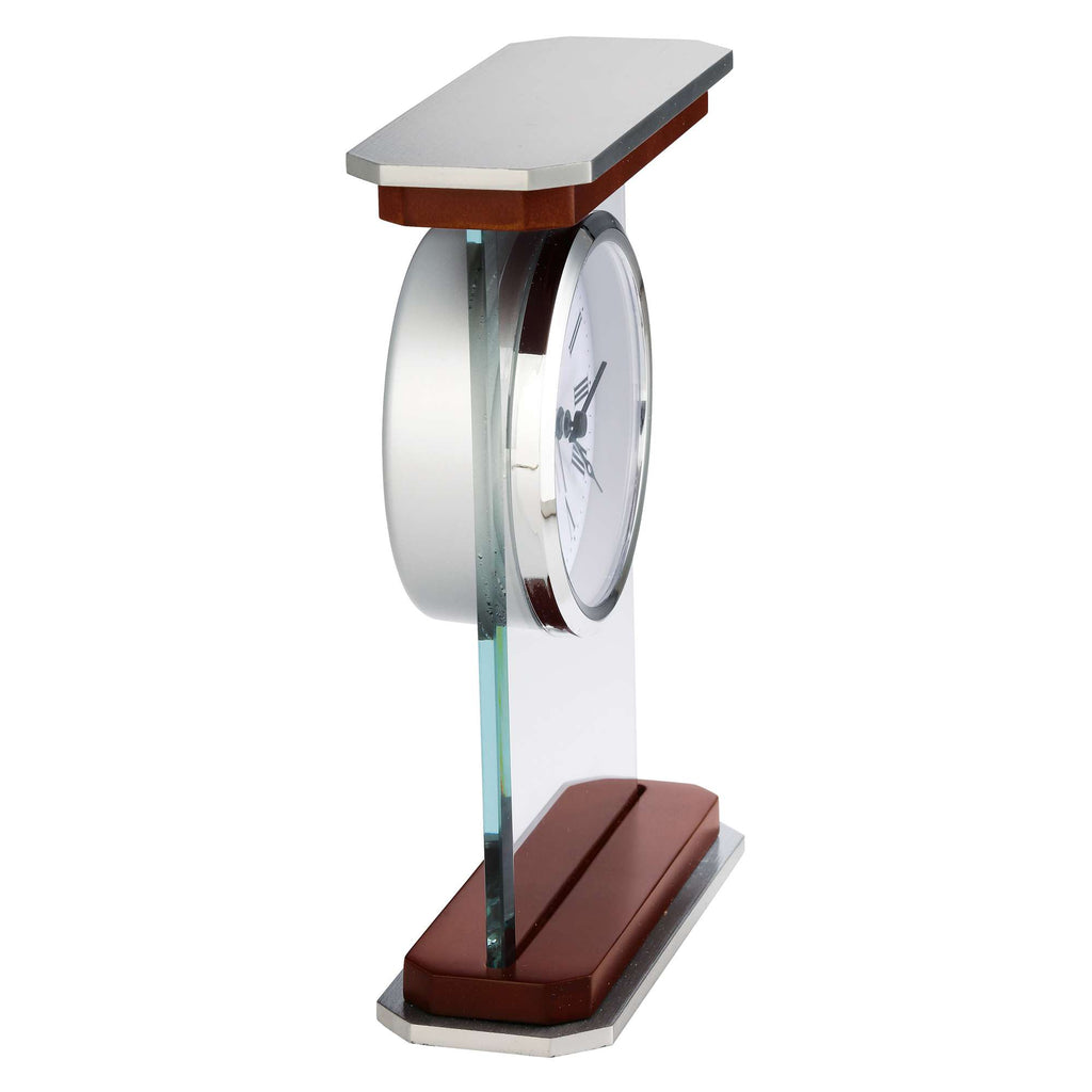 A modern desk clock with a sleek design featuring a circular clock face and a mix of glass, metal, and wood materials.