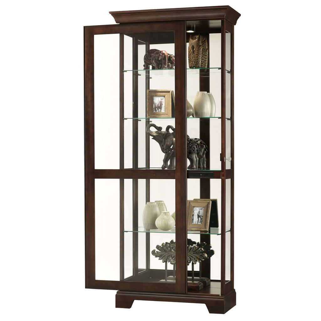 Elegant wooden display cabinet with glass shelves showcasing decorative items and photographs.