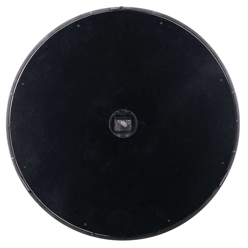 Top view of a round black surface with a small circular opening in the center.