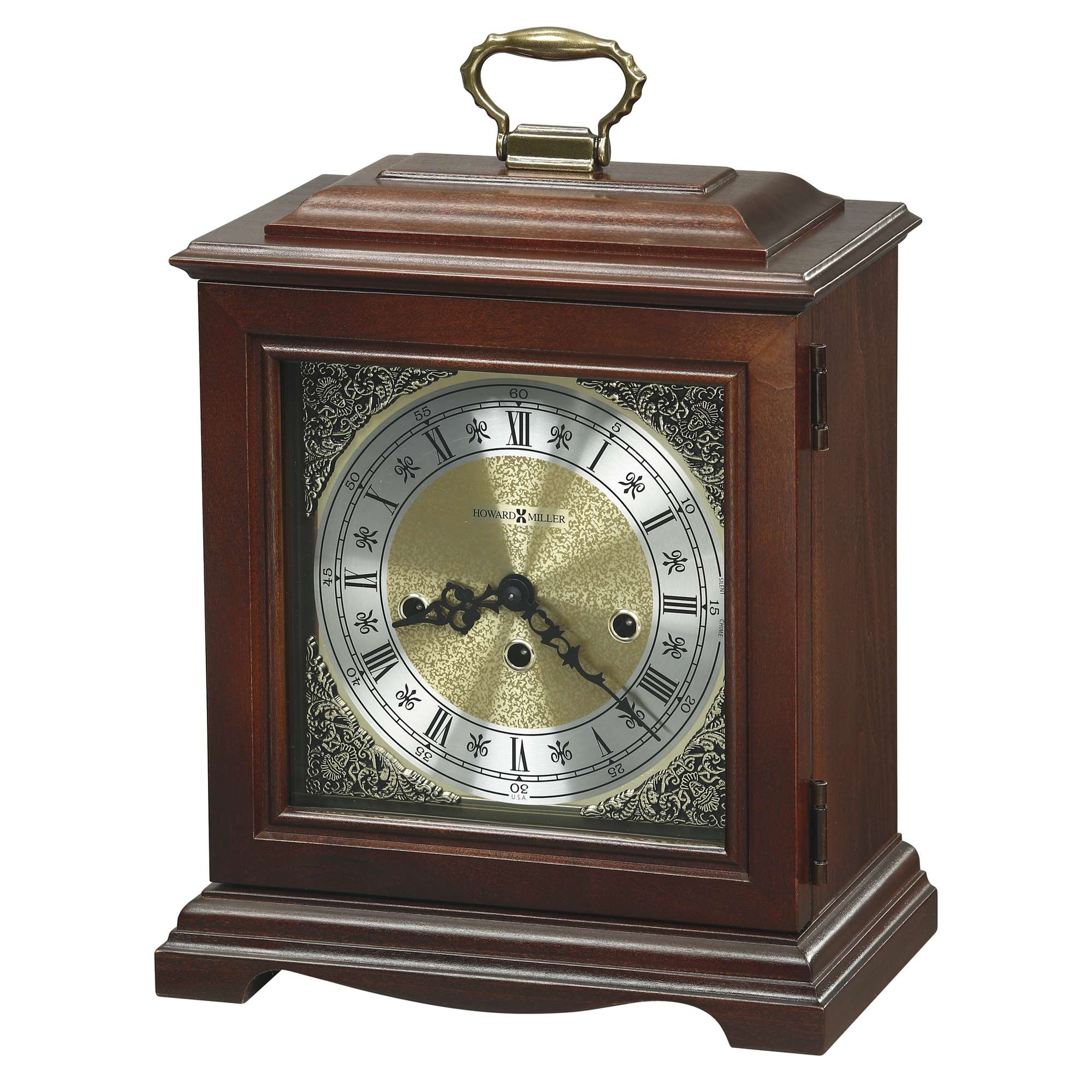 A wooden mantel clock with a gold and silver face, featuring Roman numerals and a decorative design.