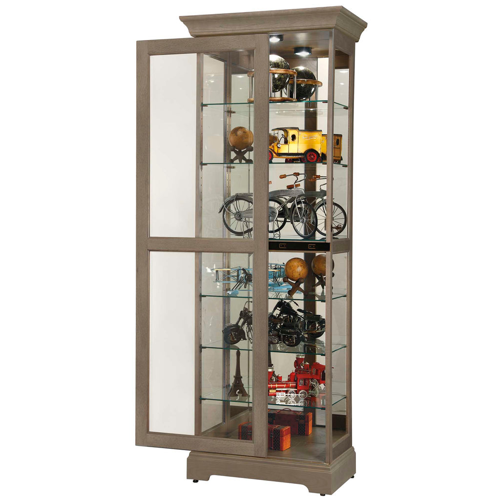 A tall, glass display cabinet showcasing various collectibles and models.