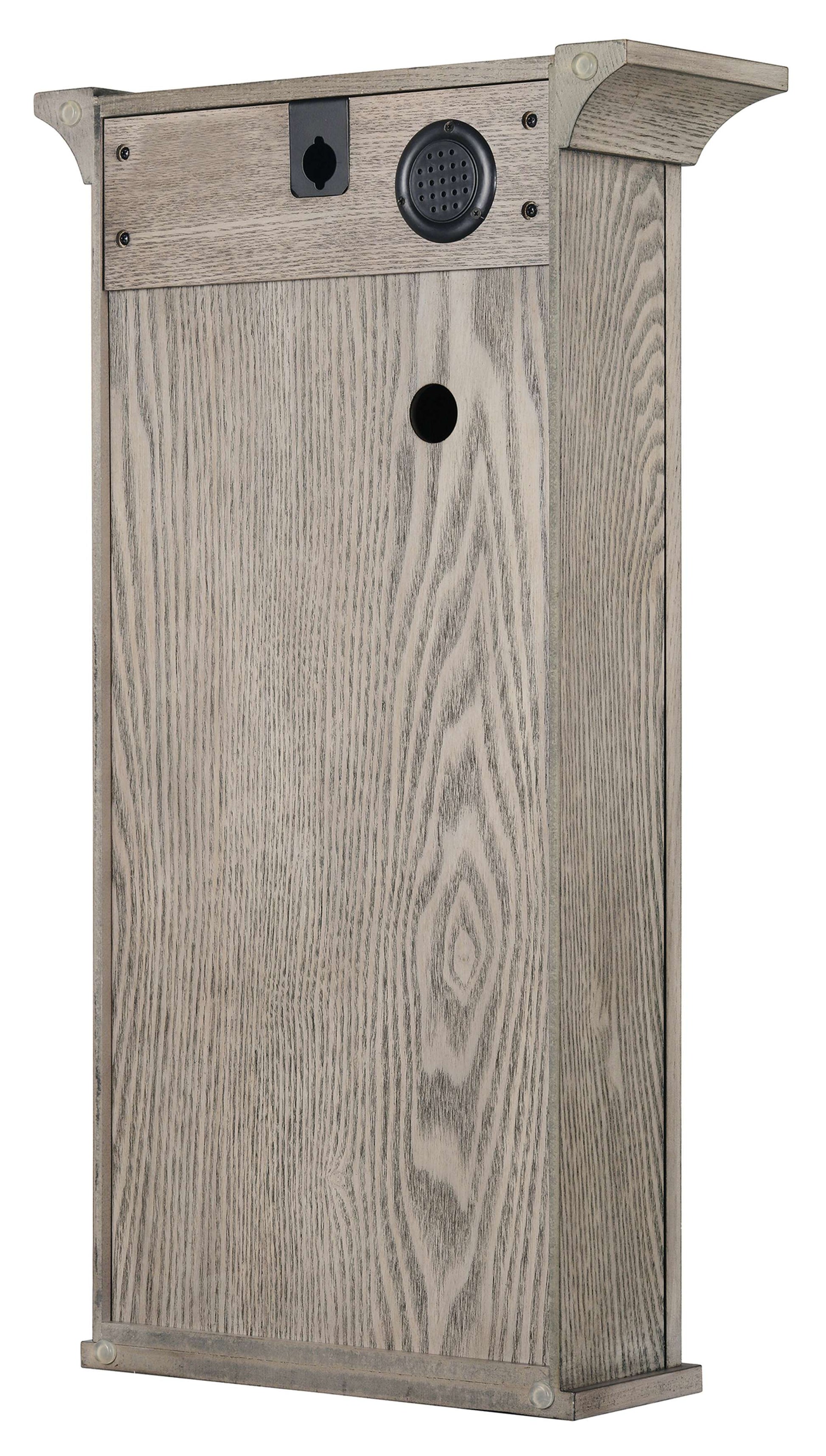 Rear view of a wooden box with holes and a textured surface