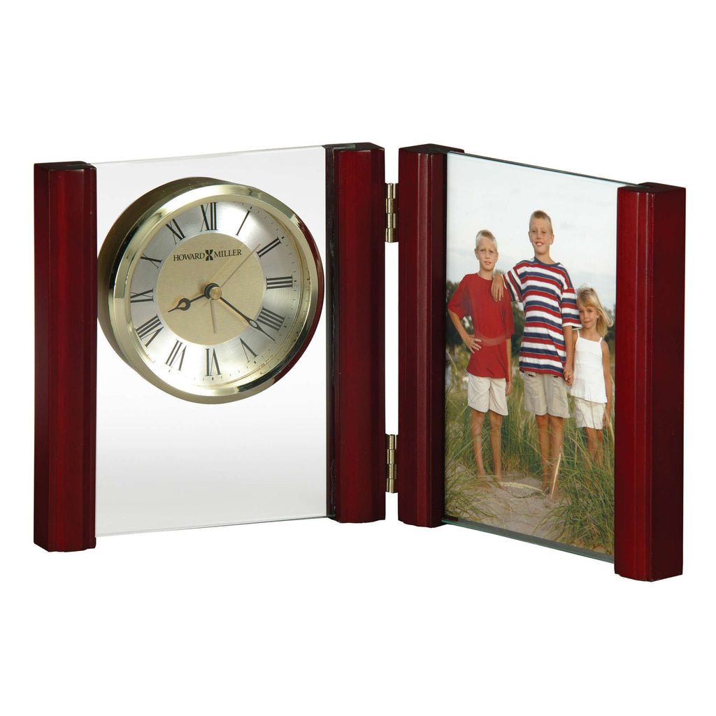 A wooden photo frame with a clock on one side and a picture of three children on the other.