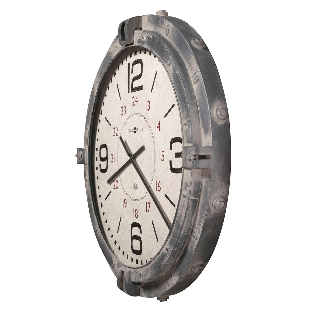 A vintage-style wall clock with large black numbers and a distressed gray frame.
