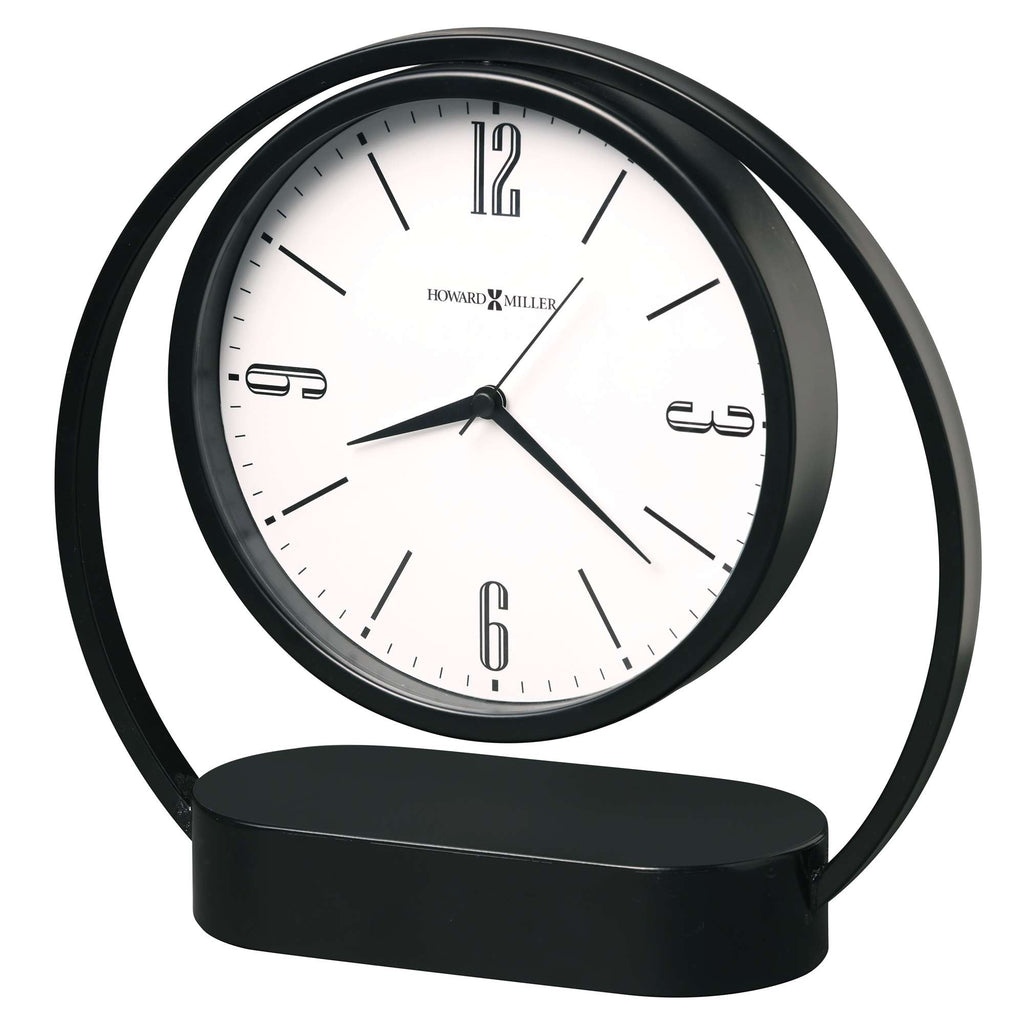 Modern black circular desk clock with white face and minimalist design.