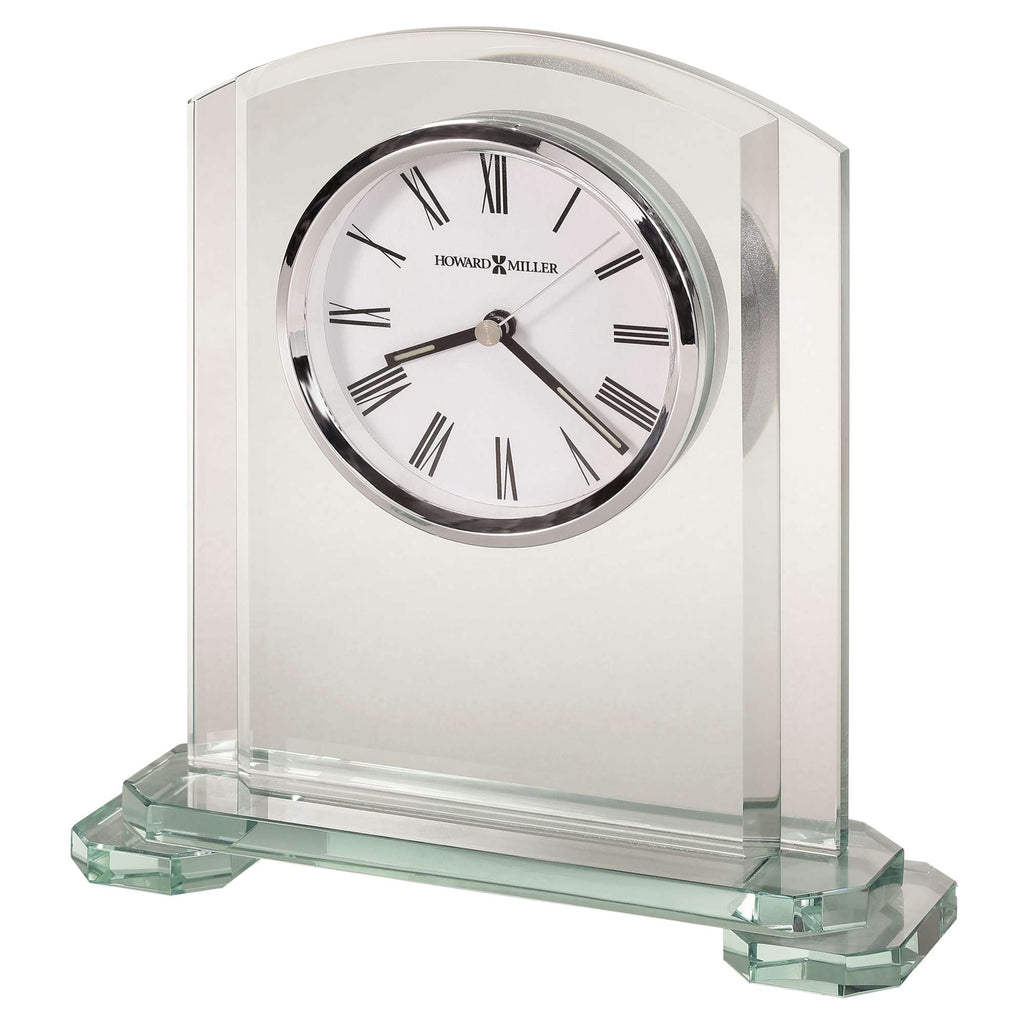 A glass desk clock with a white dial and Roman numerals.