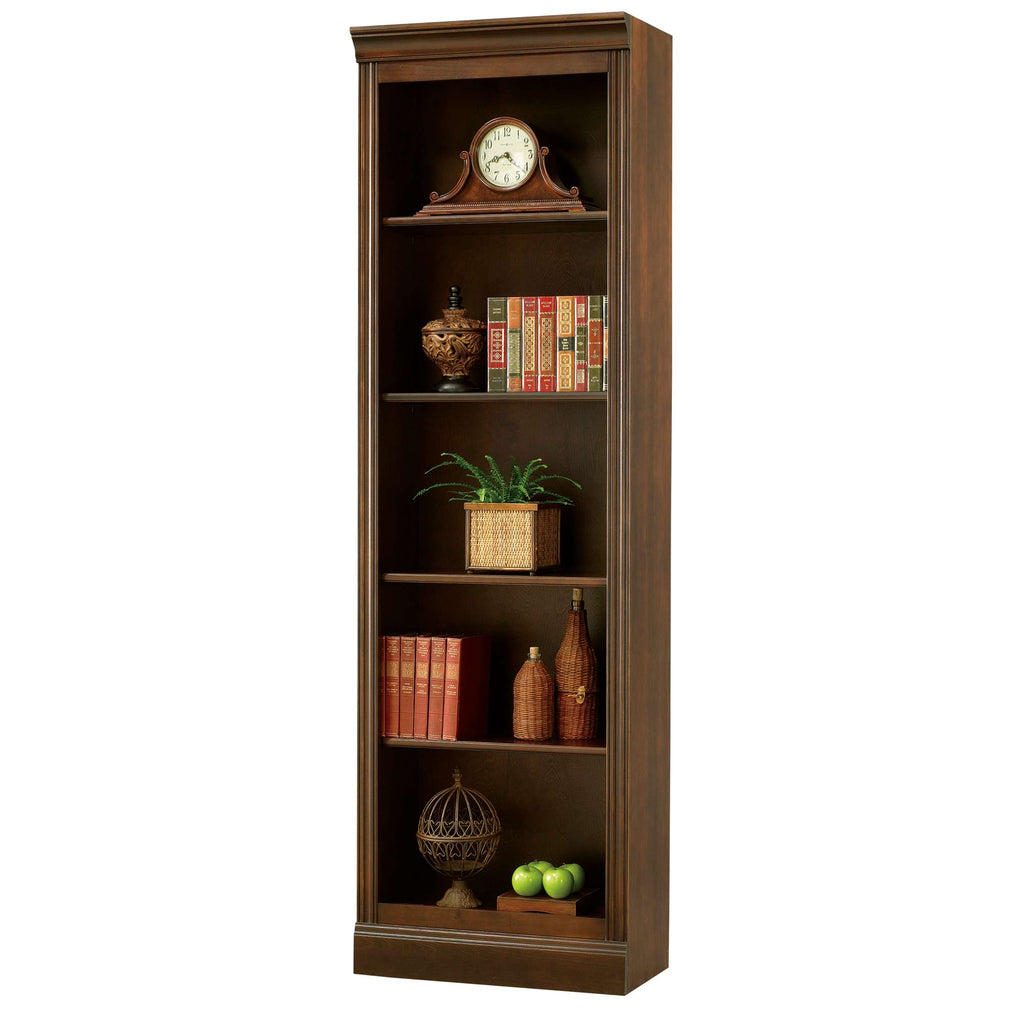 A tall wooden bookshelf with decorative items and books