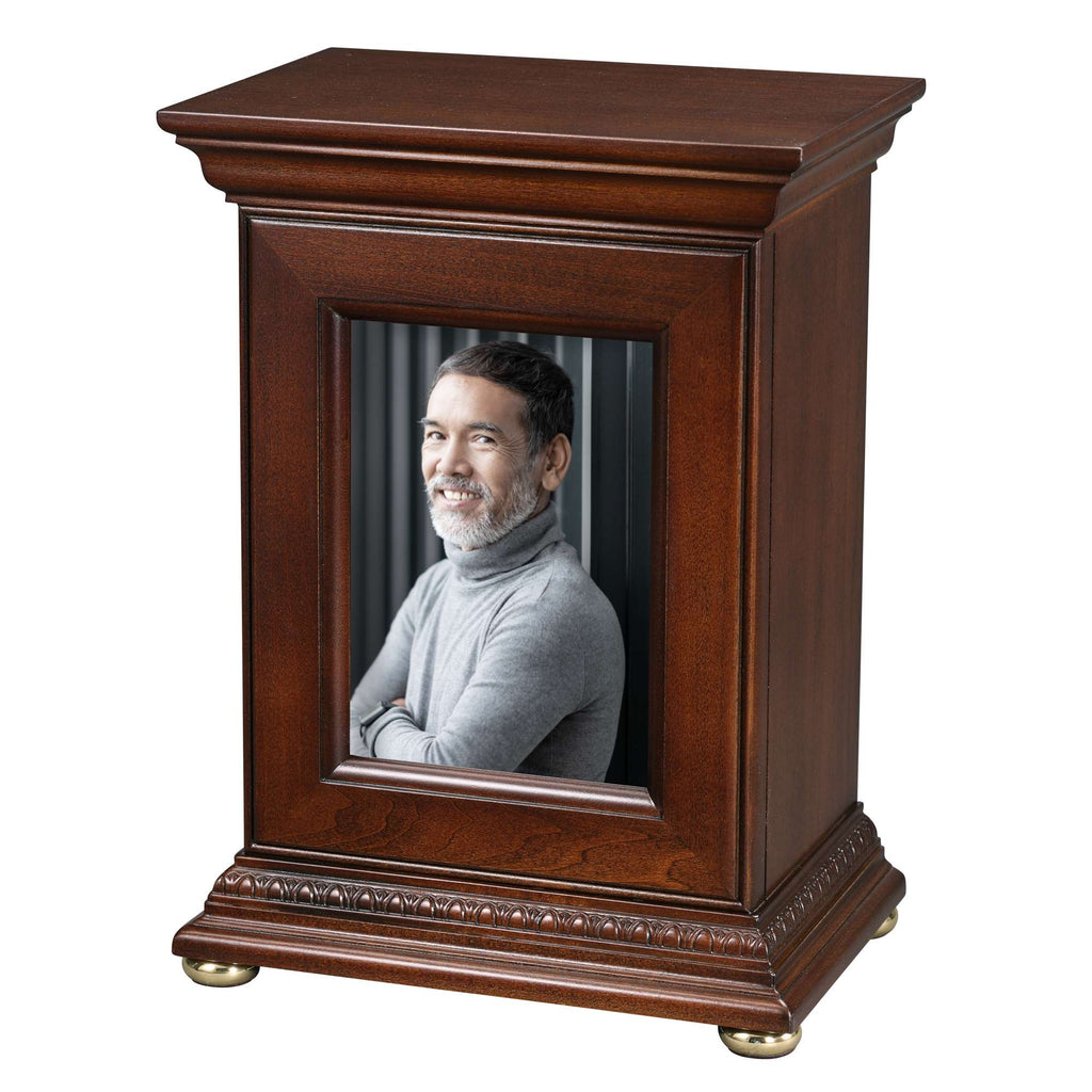 A wooden photo frame displaying a smiling individual.