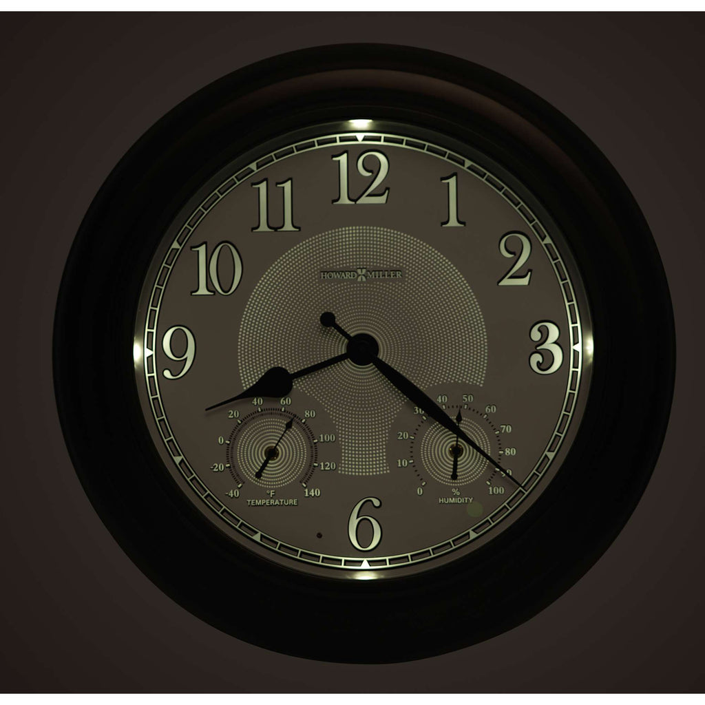 A wall clock with visible hour, minute, and second hands, featuring two additional dials for measuring temperature and humidity.
