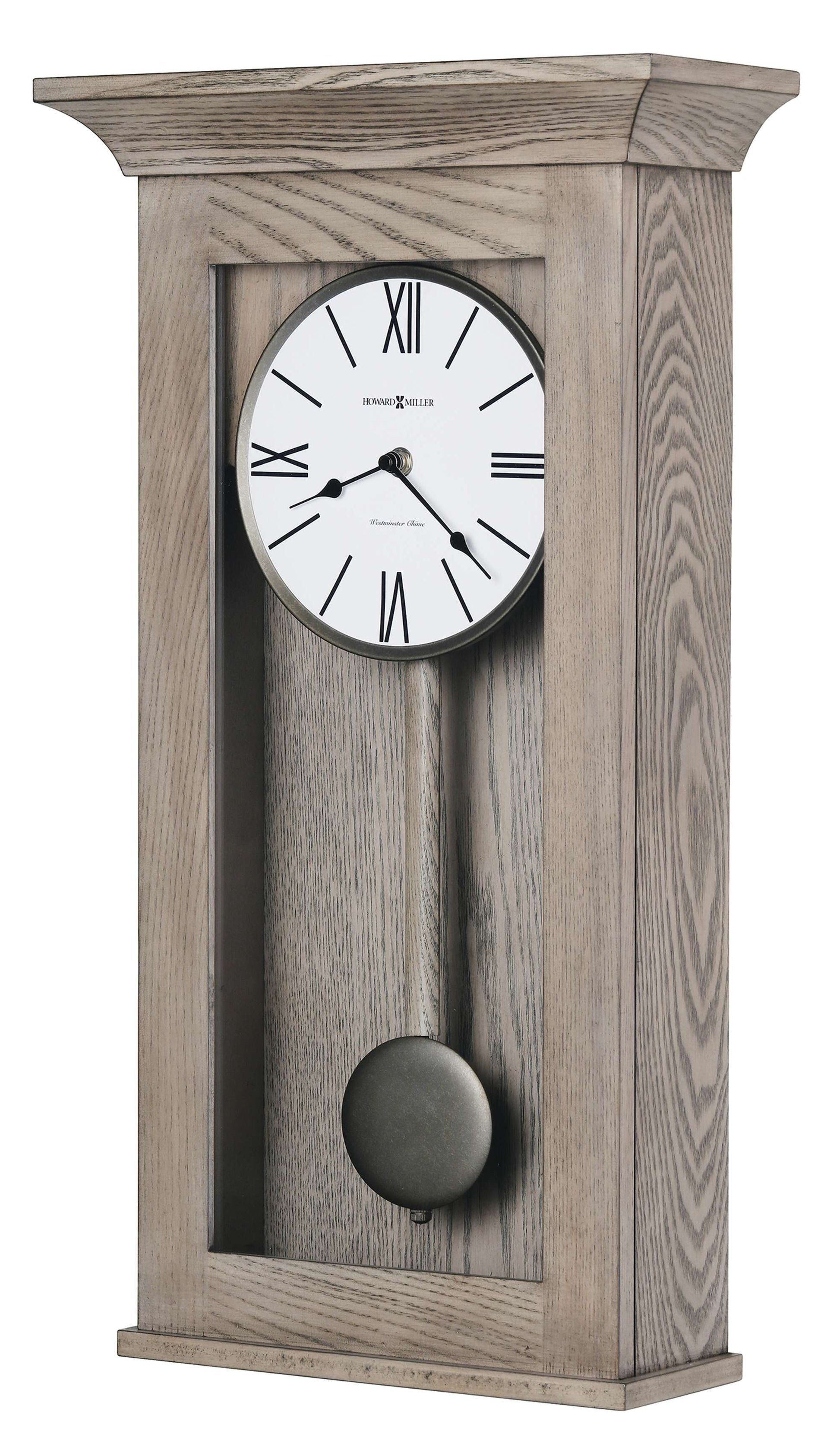 A vintage-style wall clock with a round face, Roman numerals, and a pendulum, set in a light wood frame.