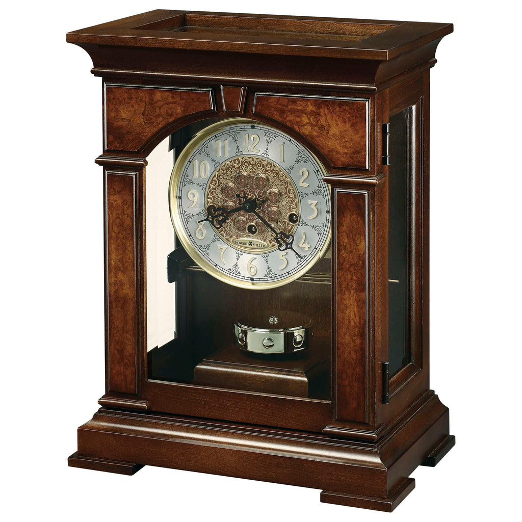 A decorative wooden mantel clock with glass panels and intricate dial.