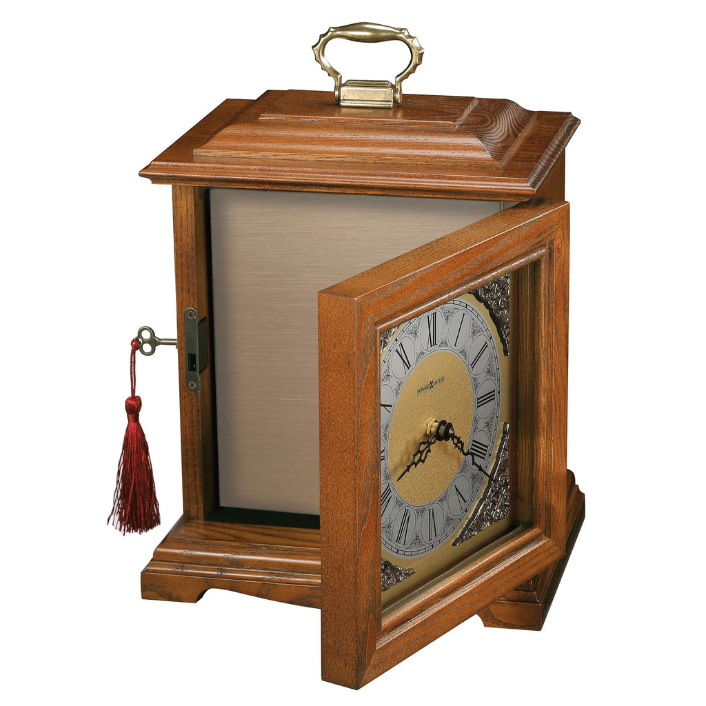 A wooden mantel clock with a decorative open door and a gold face.