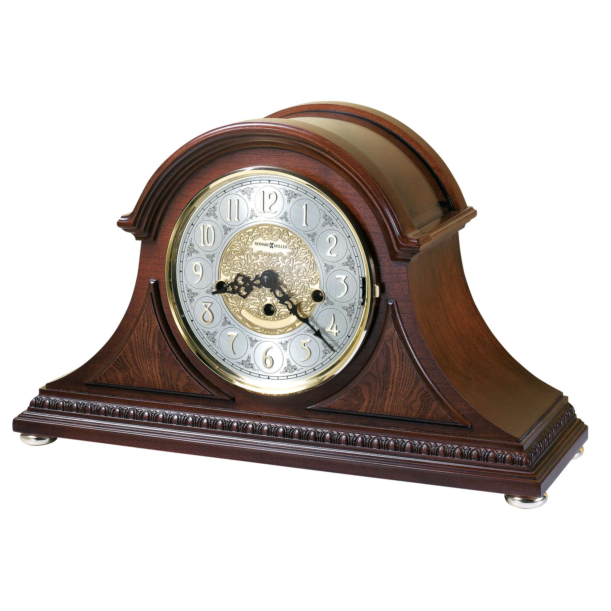 Elegant wooden mantle clock with a silver and gold face, featuring arabic numerals.