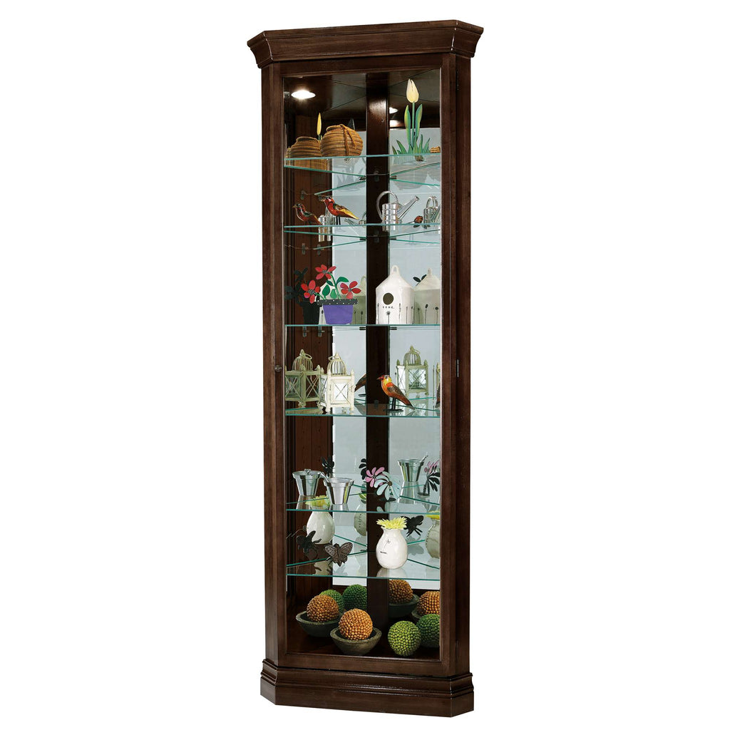 A tall display cabinet with glass shelves showcasing various decorative items.