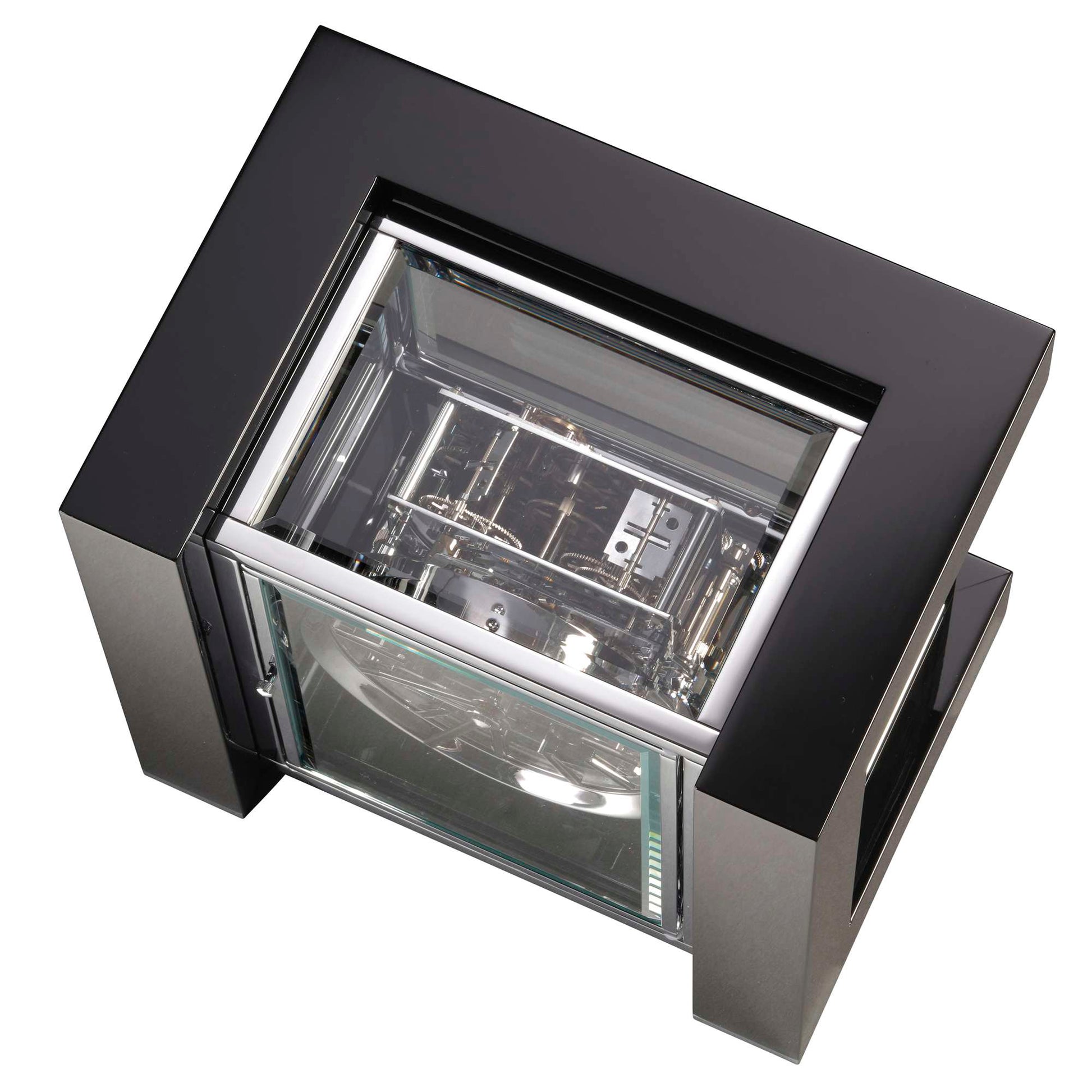 A top view of a modern, minimalist clock with a transparent casing