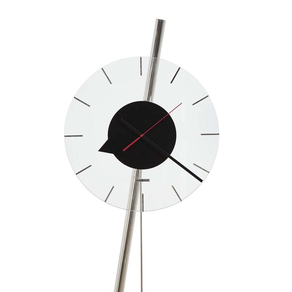 Modern abstract wall clock with a circular design and minimalist features.