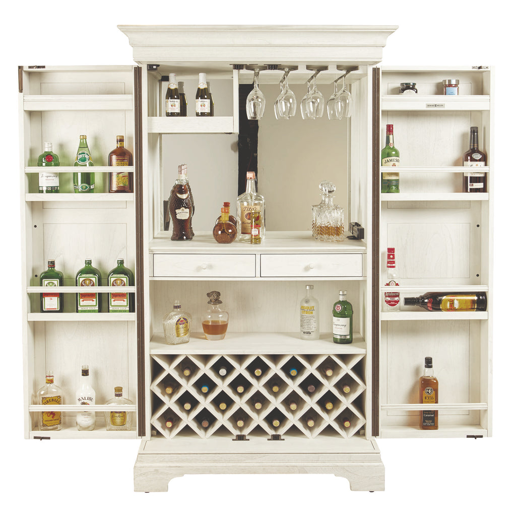 A white wooden liquor cabinet with shelves for bottles and wine glasses.