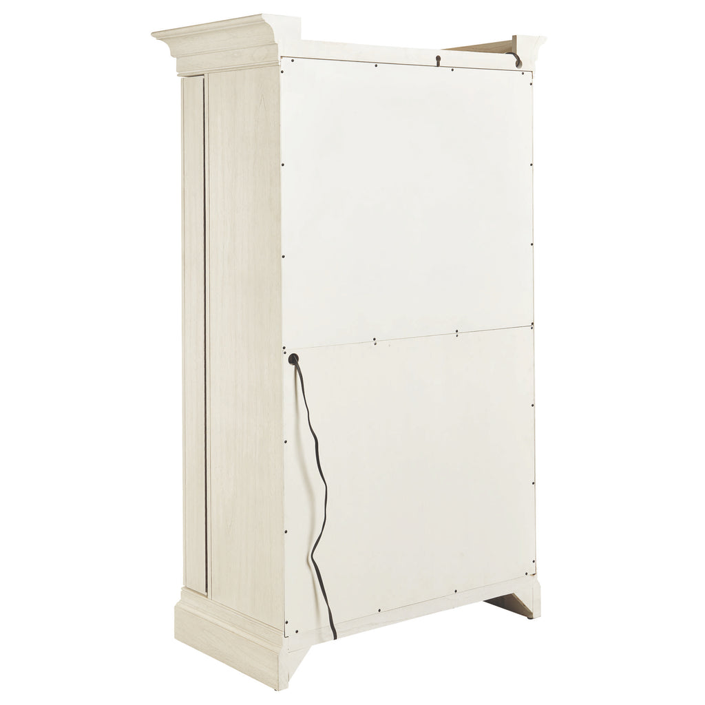 A tall, cream-colored cabinet with a smooth white front surface and a visible power cord.