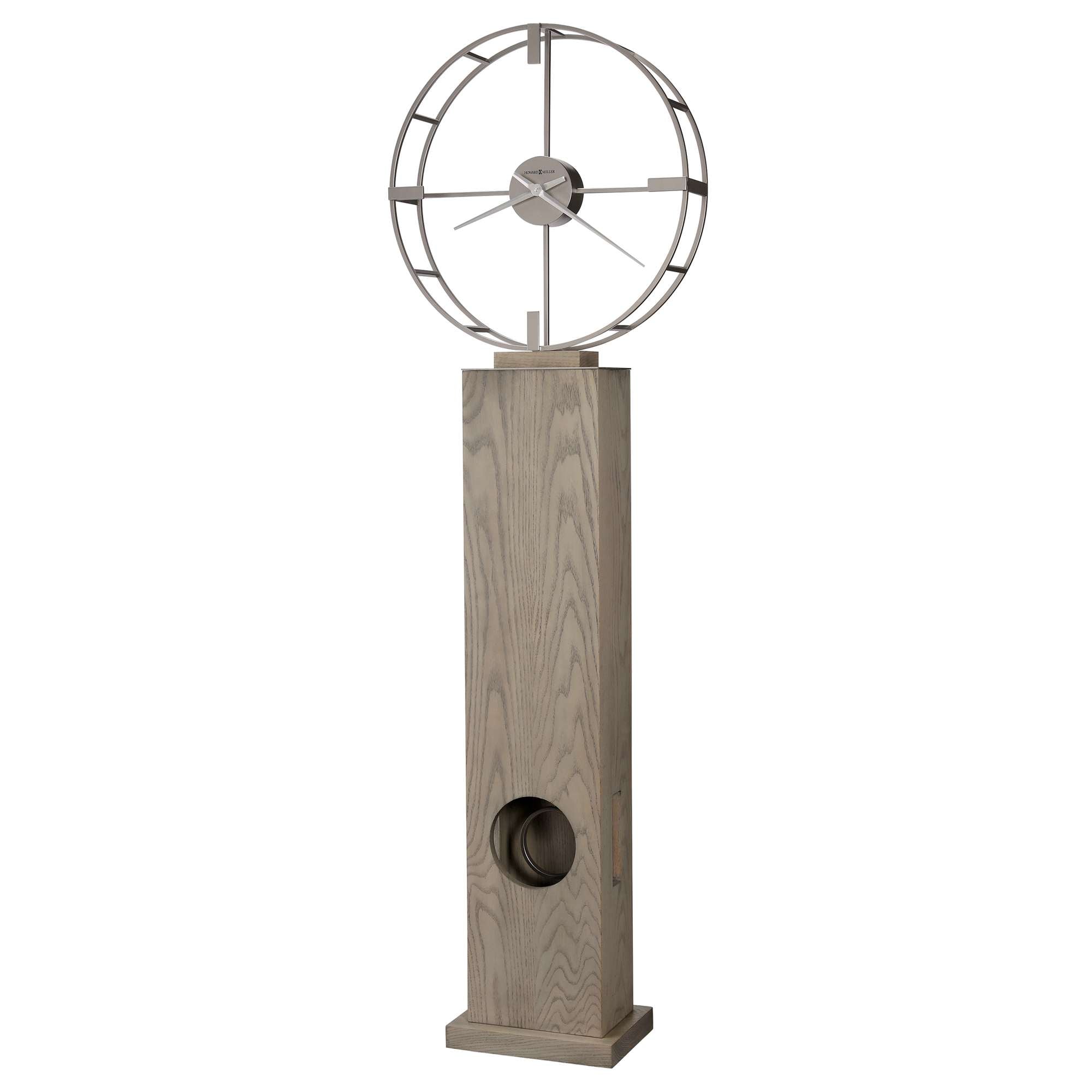 Modern decorative object featuring a circular design mounted on a tall, textured base.
