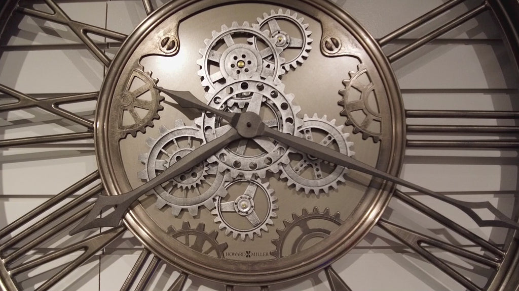 Close-up of a decorative wall clock showcasing intricate gears and hands.