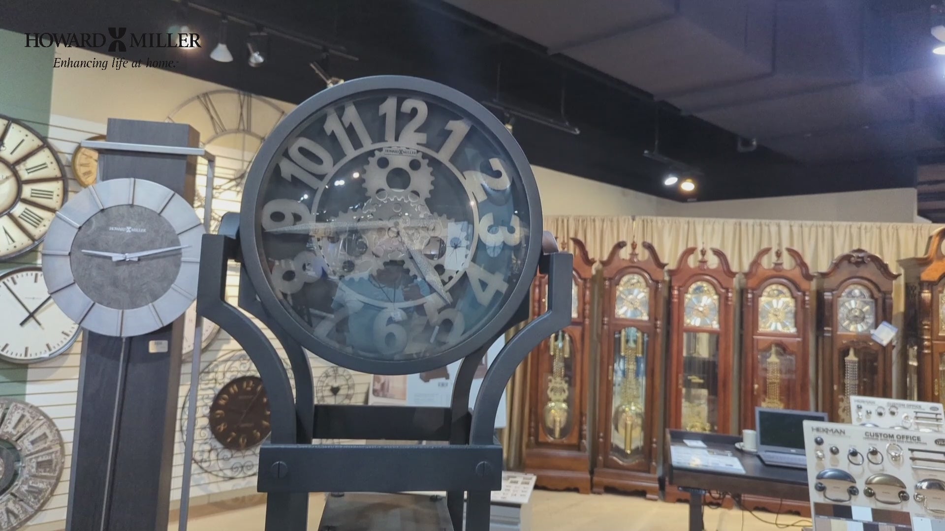 A decorative clock display in a clock shop, featuring multiple styles of clocks in the background.