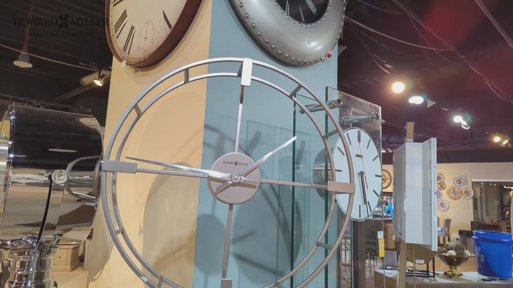 A variety of decorative clocks displayed in a room.