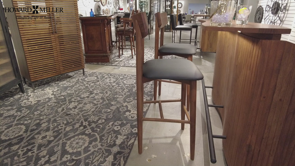 Barstools in a stylish interior setting with a patterned rug.