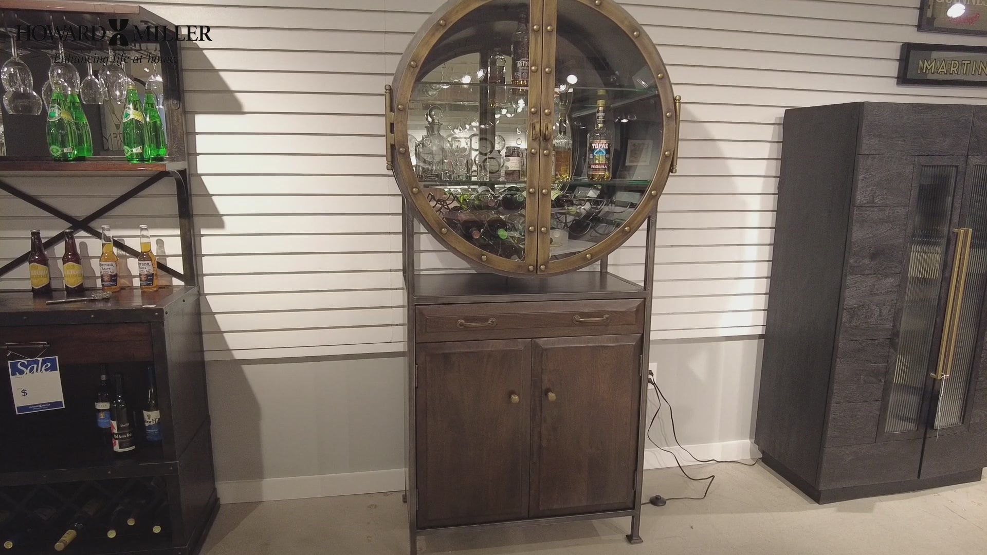 Display cabinet with a circular glass top and wooden base