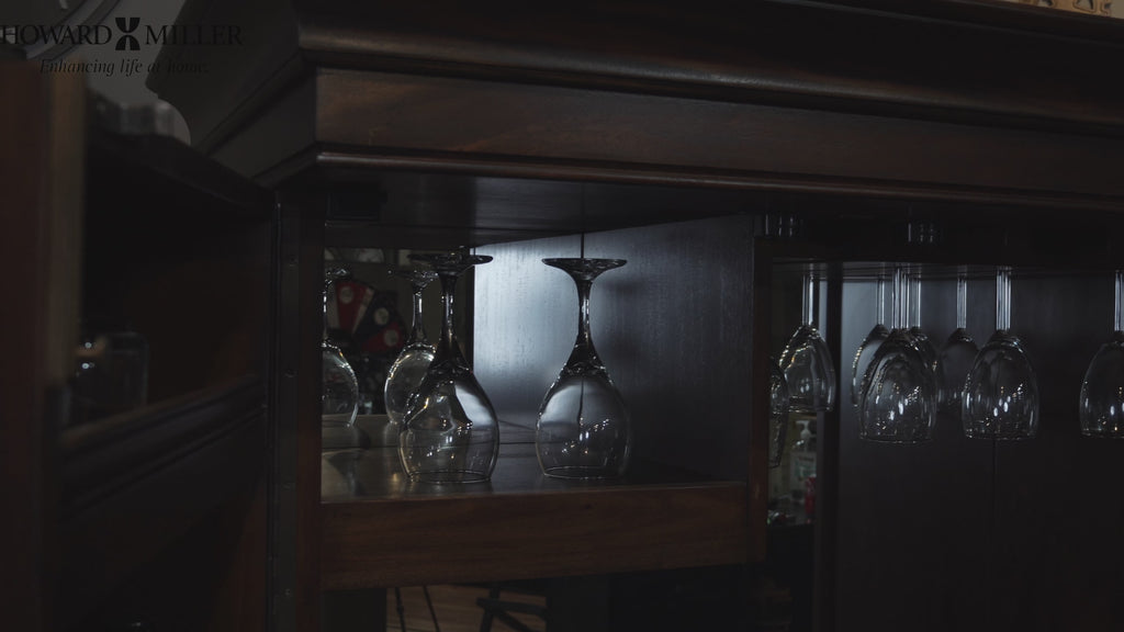 View of hanging wine glasses in a wooden cabinet